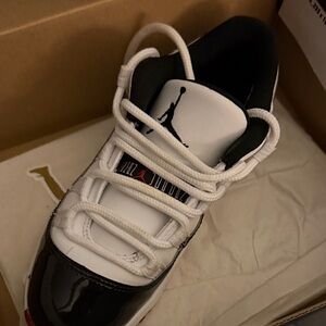 Classic Black and White Sneakers with Red Detail